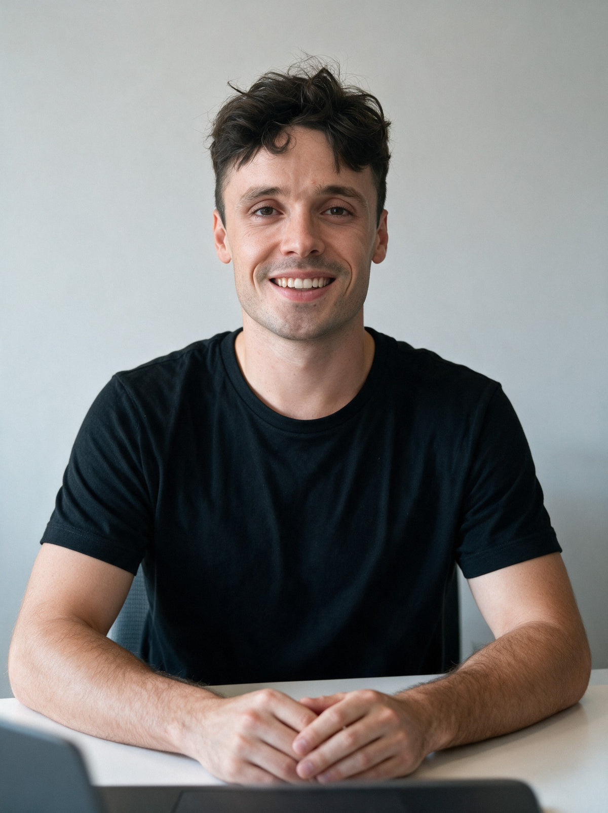 Aurélien, founder of Scalypin, seated at his desk with his laptop