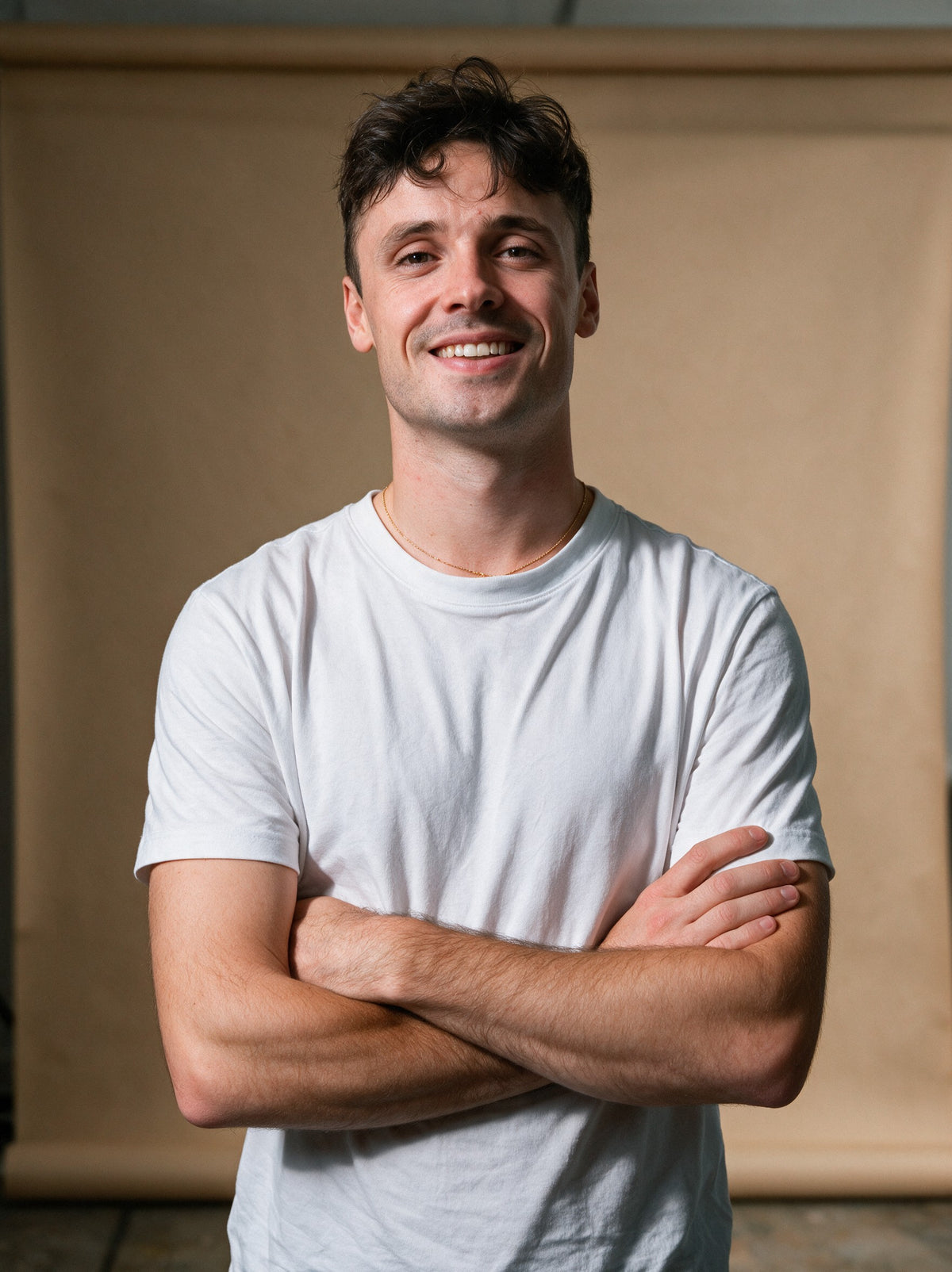 Aurélien, founder of Scalypin, smiling with arms crossed