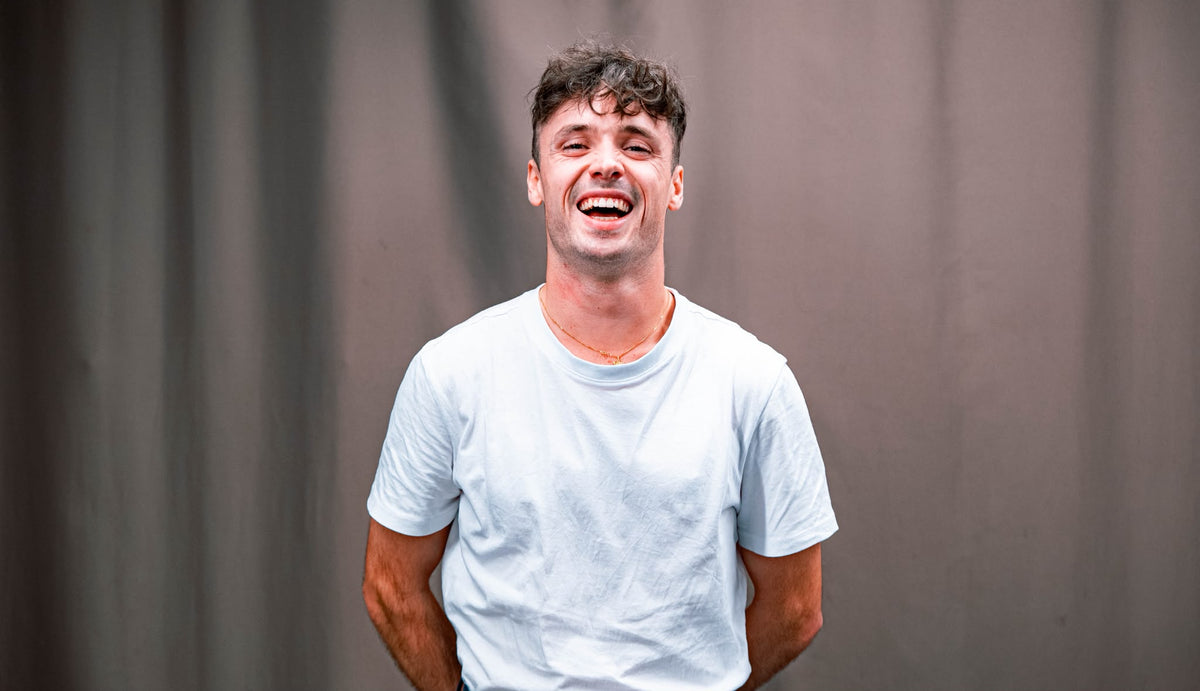 Aurélien, founder of Scalypin, laughing in a white t-shirt