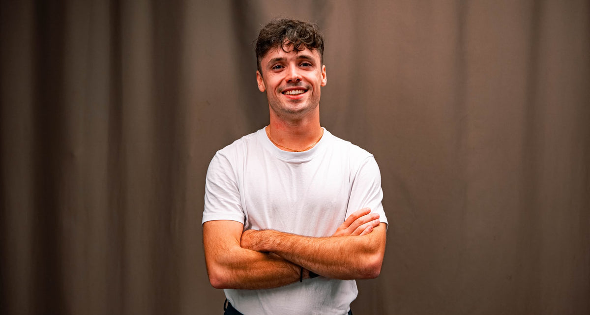 Aurélien, founder of Scalypin, smiling with arms crossed in a white t-shirt